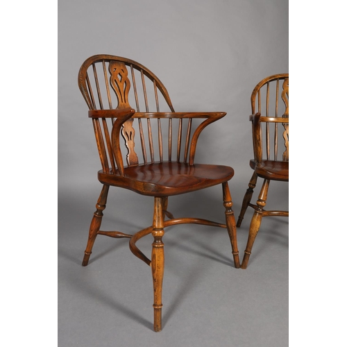 283 - A PAIR OF LOW BACK ELM WINDSOR ARMCHAIRS BY BATHEASTON, railed backs, shepherd's crook arm uprights,... 