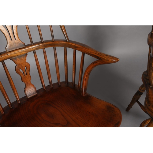 283 - A PAIR OF LOW BACK ELM WINDSOR ARMCHAIRS BY BATHEASTON, railed backs, shepherd's crook arm uprights,... 