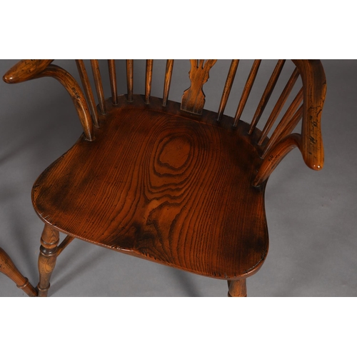 283 - A PAIR OF LOW BACK ELM WINDSOR ARMCHAIRS BY BATHEASTON, railed backs, shepherd's crook arm uprights,... 