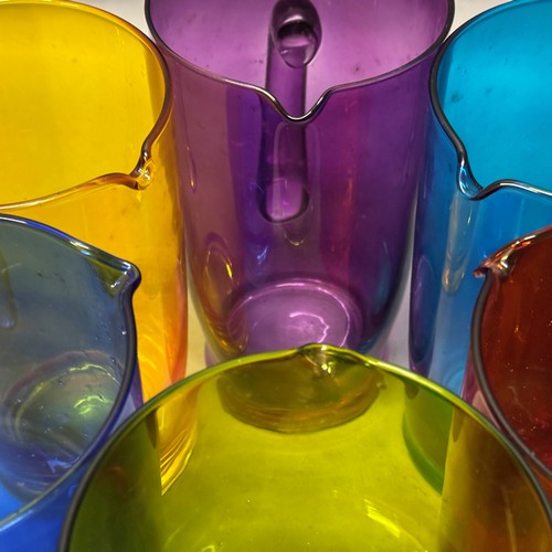 55 - A set of six 'Stone the Crows!' glass pitchers in six colour ways, 21cm high (6) Ref: 561608