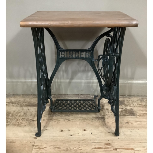 A Singer treadle sewing machine base with new pine top, 60cm wide x ...