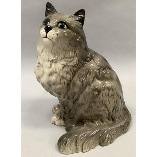 24 - A Beswick model of a cat sitting, stamped and impressed number 1867, 21cm high