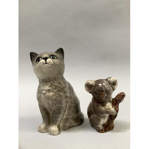 28 - A Beswick grey cat sitting, printed mark, 10cm, a koala bear, printed mark, 6cm, and a Beswick bisqu... 
