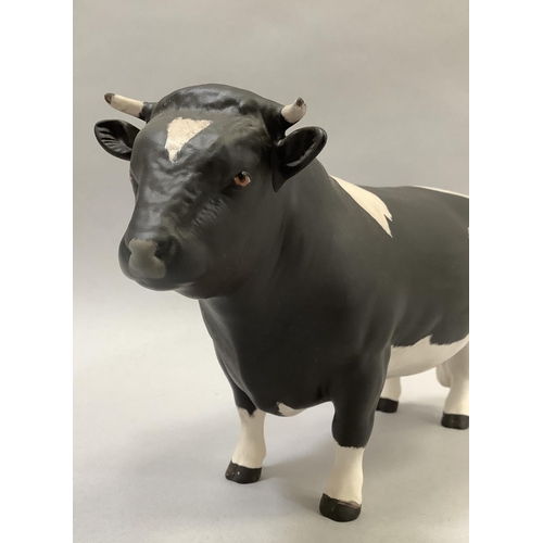 31 - A Beswick Friesian cow 'Champion Coddington Hiltbar', printed mark and title, 12.5cm, together with ... 