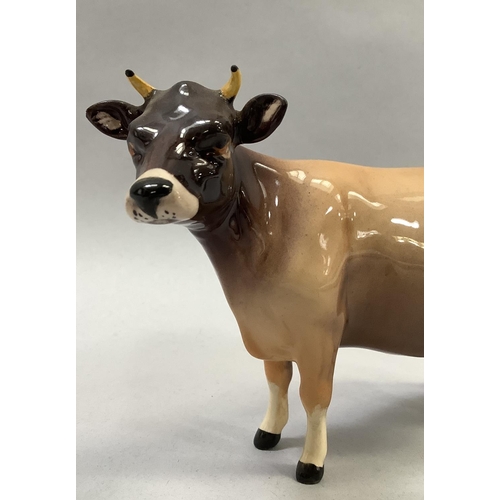 31 - A Beswick Friesian cow 'Champion Coddington Hiltbar', printed mark and title, 12.5cm, together with ... 