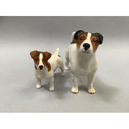33 - A Beswick model of a donkey, a calf, a Collie dog, and a Jack Russell, the donkey, 11cm high, and a ... 