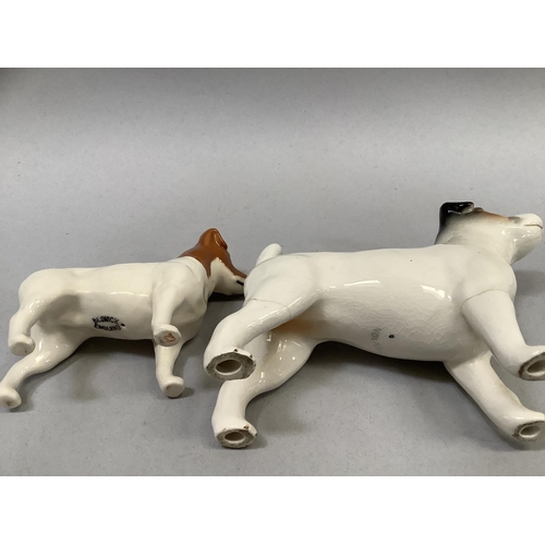 33 - A Beswick model of a donkey, a calf, a Collie dog, and a Jack Russell, the donkey, 11cm high, and a ... 