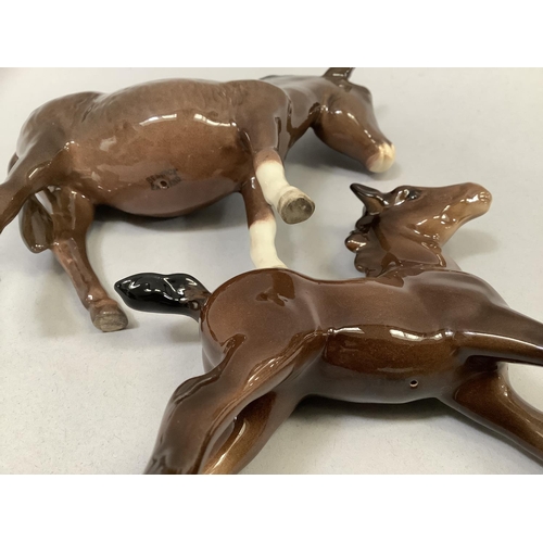 33 - A Beswick model of a donkey, a calf, a Collie dog, and a Jack Russell, the donkey, 11cm high, and a ... 