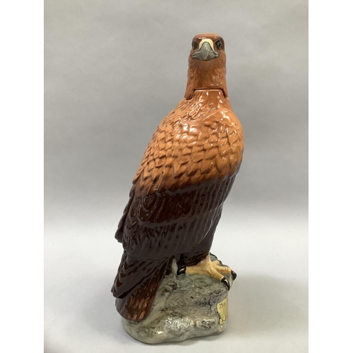 34 - A Beswick Golden Eagle decanter for Gleneagles Scotch whiskey, a liqueur bottle modelled by J G Tong... 