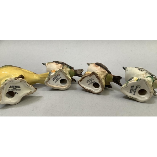 35 - Four Beswick birds including Greenfinch 2105, and three Goldcrest 2415 (one with chip to beak), the ... 