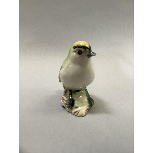 35 - Four Beswick birds including Greenfinch 2105, and three Goldcrest 2415 (one with chip to beak), the ... 