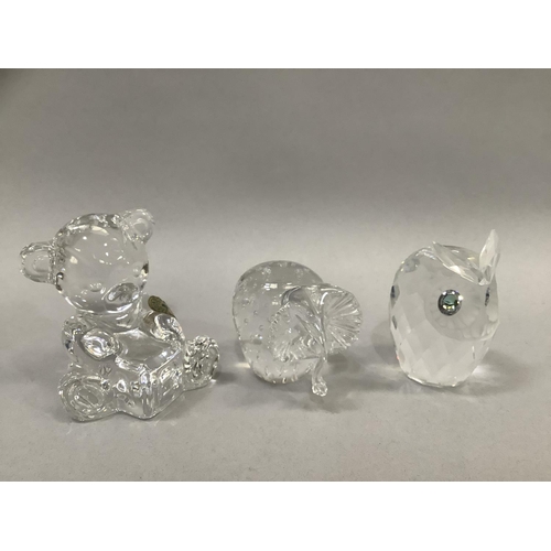 44 - A Waterford glass teddy bear, 7.5cm high, a Swarovski owl, 6cm high, a glass elephant, 5.5cm high, a... 
