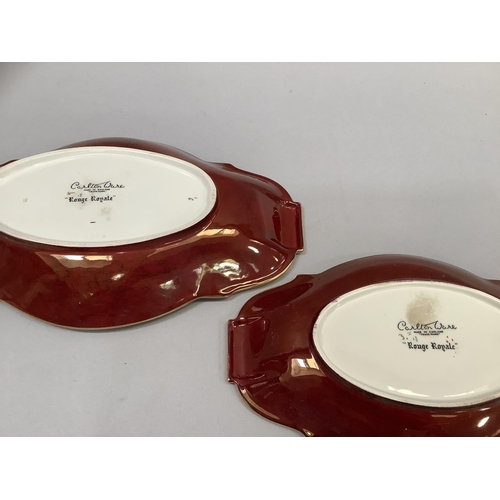 56 - Three items of Carlton ware Rouge Royale including an oval two handled dish with temple pattern, 31c... 