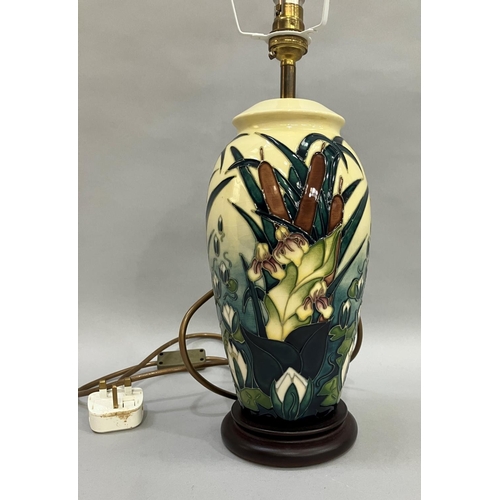 57 - A Moorcroft Lamia pattern table lamp, painted and tube lined in shades of green and pale yellow, 34.... 