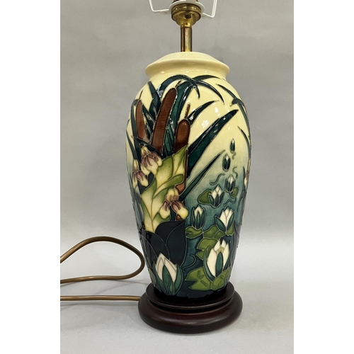 57 - A Moorcroft Lamia pattern table lamp, painted and tube lined in shades of green and pale yellow, 34.... 