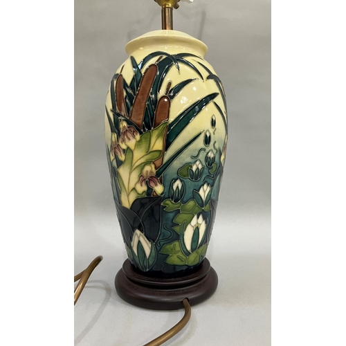 57 - A Moorcroft Lamia pattern table lamp, painted and tube lined in shades of green and pale yellow, 34.... 