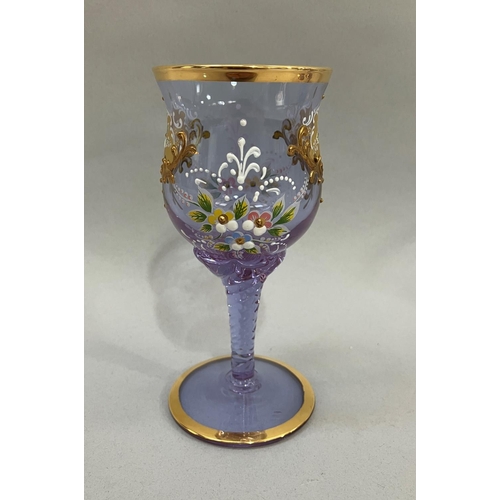 58 - A continental pale lilac glass wine set comprising claret jug, 40.5cm high, and six goblets each pai... 