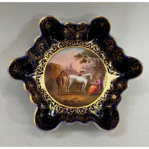 60 - A Vienna porcelain dish of hexagonal scalloped outline painted to the well with travellers and horse... 