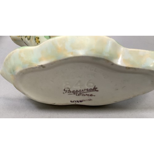 41 - A Beswick flower vase in the form of a basket with loop handle painted in blue, yellow, green, and m... 