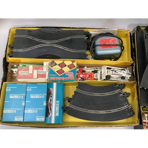 14 - A Scalextric '60' set model motor racing, large quantity of track, and a Scalextric '80' set four in... 