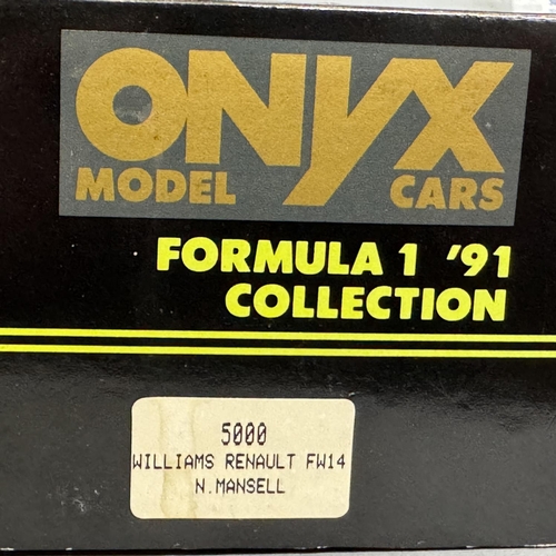 28 - An IXO die-cast scale model of a 1977 Tyrrell P34, a Mini GT die-cast scale model of the 1976 Tyrrel... 