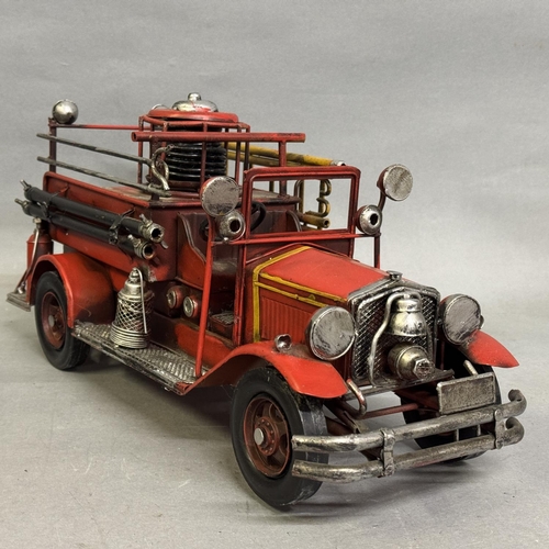 36 - Two detailed modern tin plate models of a 1930s-style fire engine and a turn-of-the-century 0-6-4 st... 