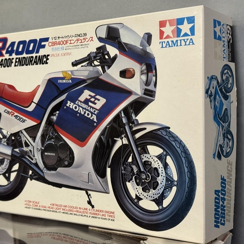 40 - A Tamiya 1/12 scale self-assembly model Honda CBR400F Endurance, two Maisto 1/12 scale die-cast mode... 