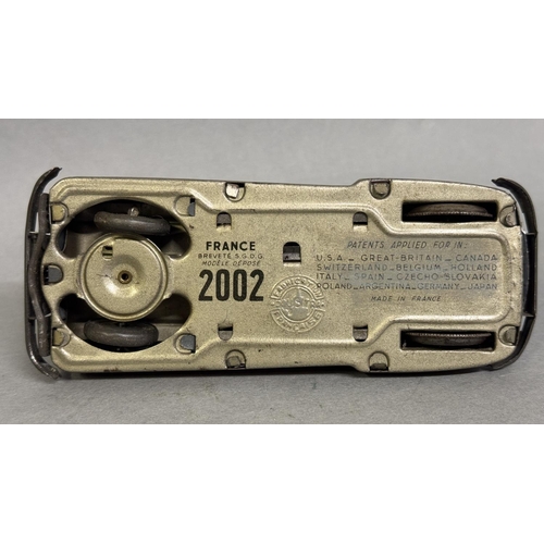 8 - A French Joustra clockwork car, in working order complete with original key. Car moves off, stops, o... 