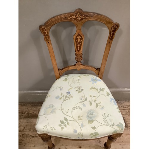 56 - A Victorian parlour chair with inlaid frame and upholstered seat on turned legs