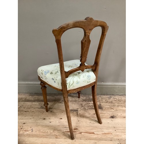 56 - A Victorian parlour chair with inlaid frame and upholstered seat on turned legs