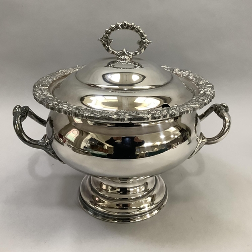 1 - A silver plated on copper two-handled soup tureen with doomed cover, gadroon loop handle, foliate ca... 