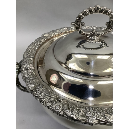 1 - A silver plated on copper two-handled soup tureen with doomed cover, gadroon loop handle, foliate ca... 