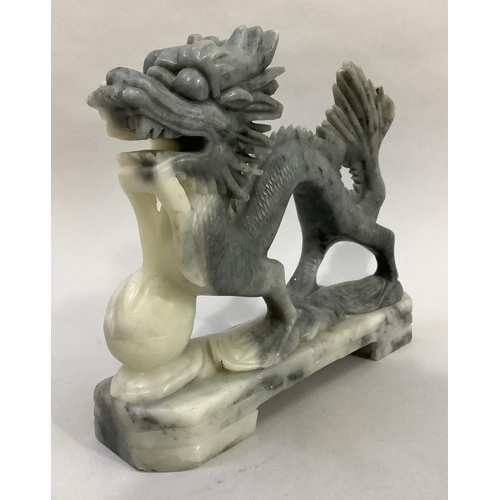 10 - A Chinese soapstone carving of a dragon with pearl, 20.5cm long x 18cm high