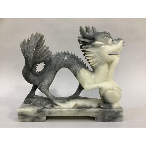 10 - A Chinese soapstone carving of a dragon with pearl, 20.5cm long x 18cm high