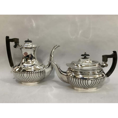 3 - A four piece silver plated tea and coffee service of oval and part reeded form comprising coffee pot... 