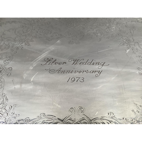 6B - A heavy plated on copper two-handled tray with foliate handles and rim, rectangular, presentation in... 