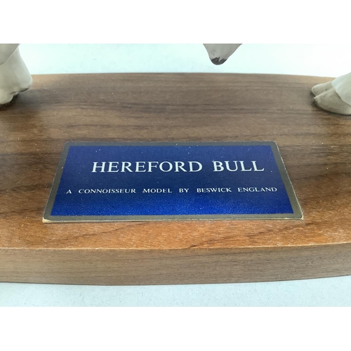 34 - 'Hereford Bull', a Connoisseur model by Beswick, on wooden plinth, 29cm long x 19cm high