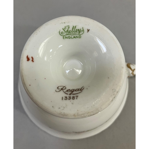 43 - An eighteen piece Shelley tea service of Regal pattern colour printed with floral sprays within a ma... 