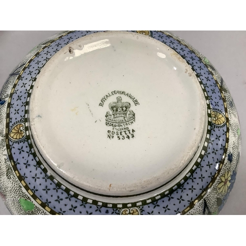 47 - An early 20th century cylinder vase of octagonal form, floral decoration, a Royal Corona ware chintz... 