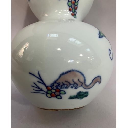 23 - A 20th century double gourd vase painted with fruiting grapevine four character mark to underside, 2... 