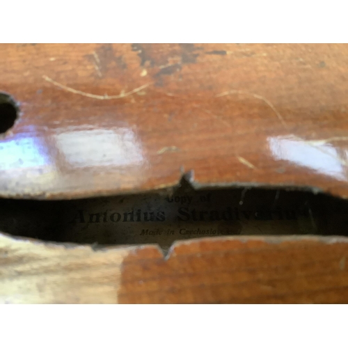 26 - A violin, the label printed 'Copy of Antonius Stradivarius', Made in Czechoslovakia, the back 37cm, ... 