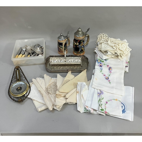 104 - Silver plated tray, wafer basket, loose cutlery, two steins, together with a quantity of table linen... 