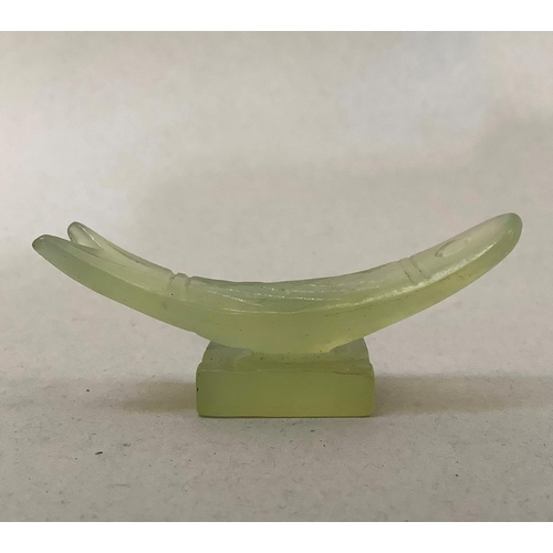 5 - A set of six pale green soapstone chopstick rests in the form of fish, approximately 5.5cm wide