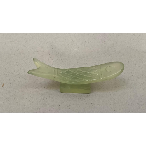 5 - A set of six pale green soapstone chopstick rests in the form of fish, approximately 5.5cm wide