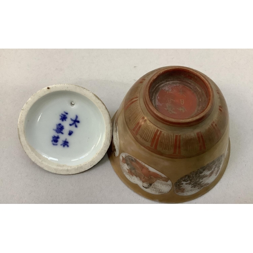 12 - A black ceramic copy of a Chinese terracotta warrior kneeling, 40cm high, (constructed in two pieces... 