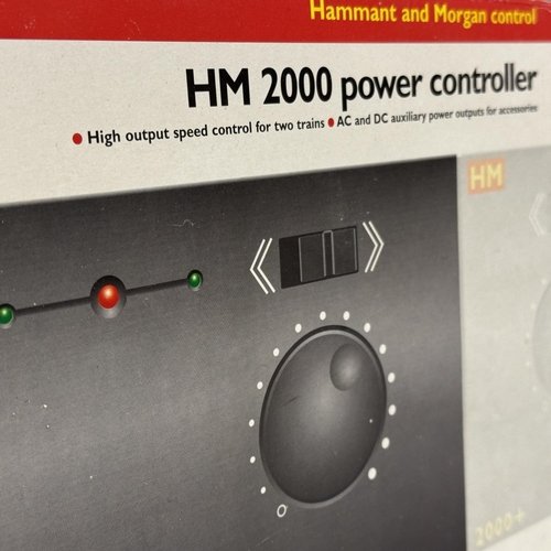 54 - A Hornby Hammant and Morgan HM2000 power controller, along with a Hammant and Morgan HM2000+ slave c... 