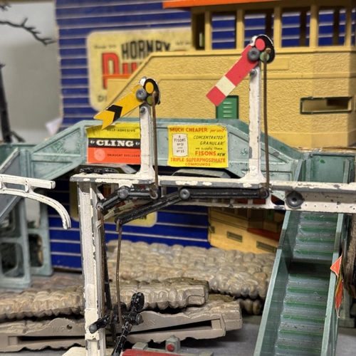 55 - A Hornby Dublo D1 Through Station, a D1 Signal Cabin and a Meccano ltd A2 Power Control Unit, along ... 