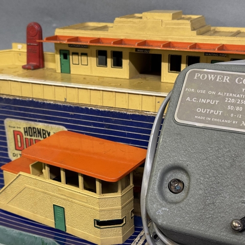 55 - A Hornby Dublo D1 Through Station, a D1 Signal Cabin and a Meccano ltd A2 Power Control Unit, along ... 