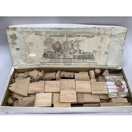 9 - Dreadnought Shipbuilding Blocks, MC & Co Ltd London, with one crust wooden blocks, flags and diagram... 