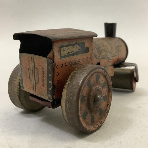 8B - A German Schuco clockwork group of two dancing mice, with key, together with a German tin plate cloc... 